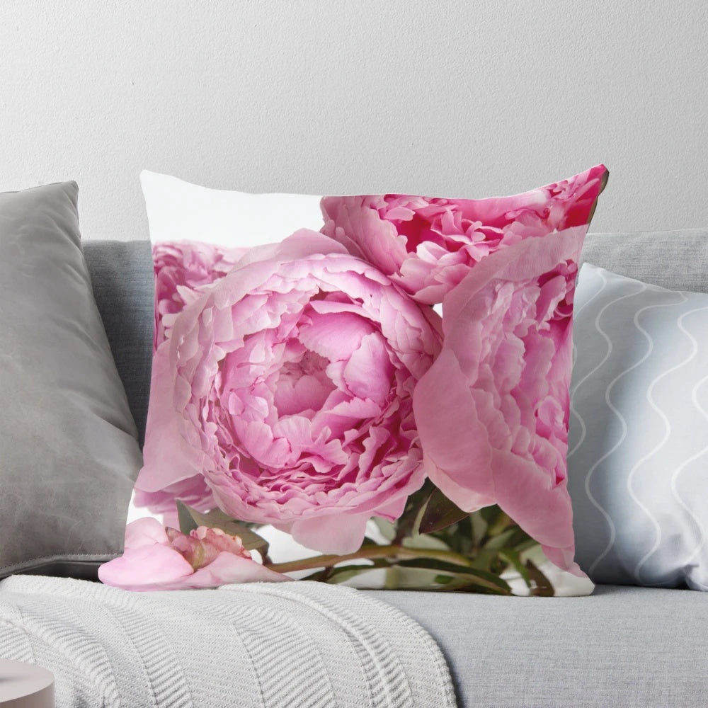 Beautifully arranged pink peonies on a decorative pillow for home decor