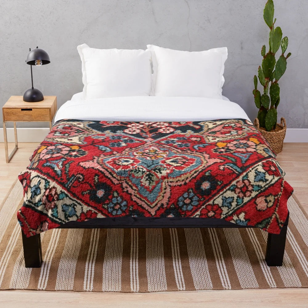 Persian-inspired plush blanket with colorful floral and abstract carpet design