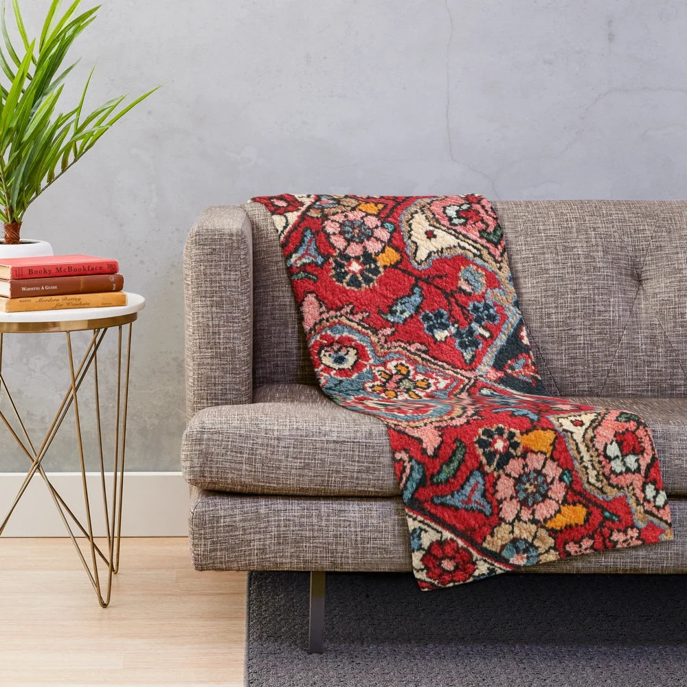 Persian-inspired plush blanket with colorful floral and abstract carpet design