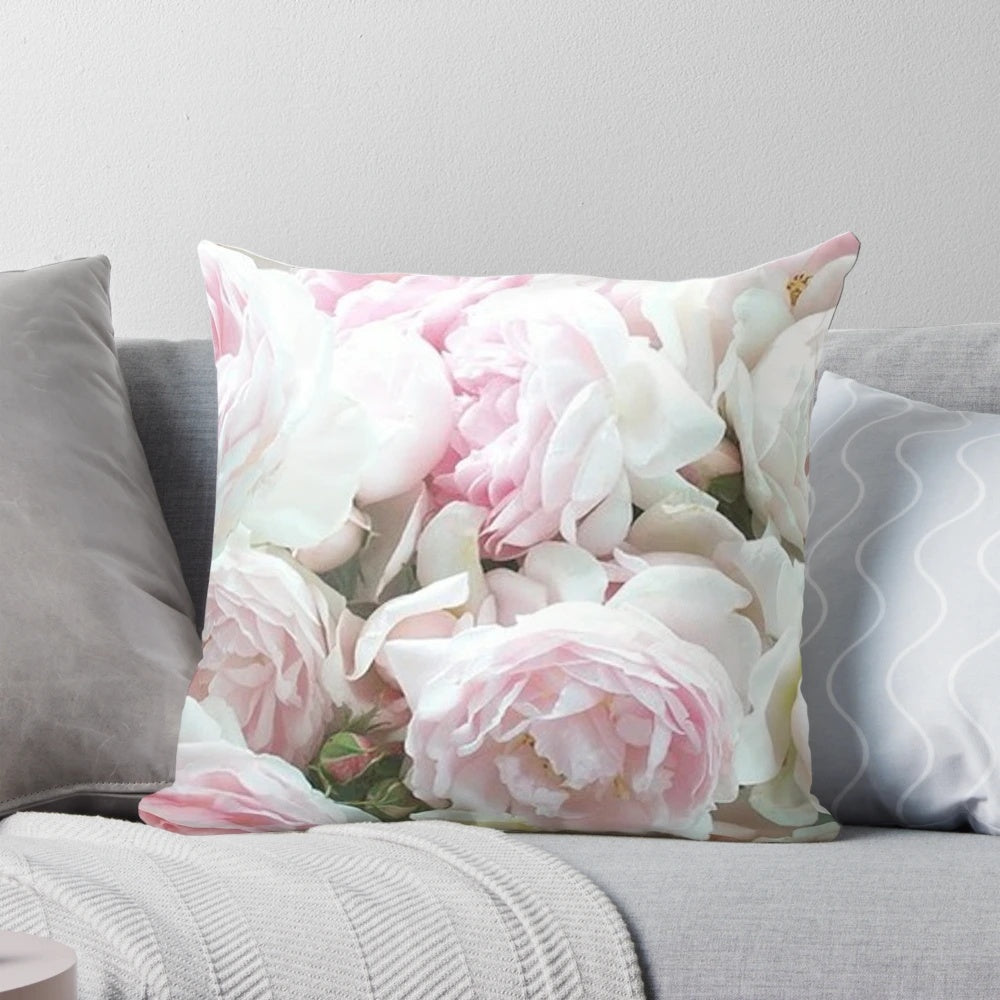 Vibrant pink and white peonies in full bloom, captured in a stunning close-up photograph and printed on a soft, plush throw pillow.