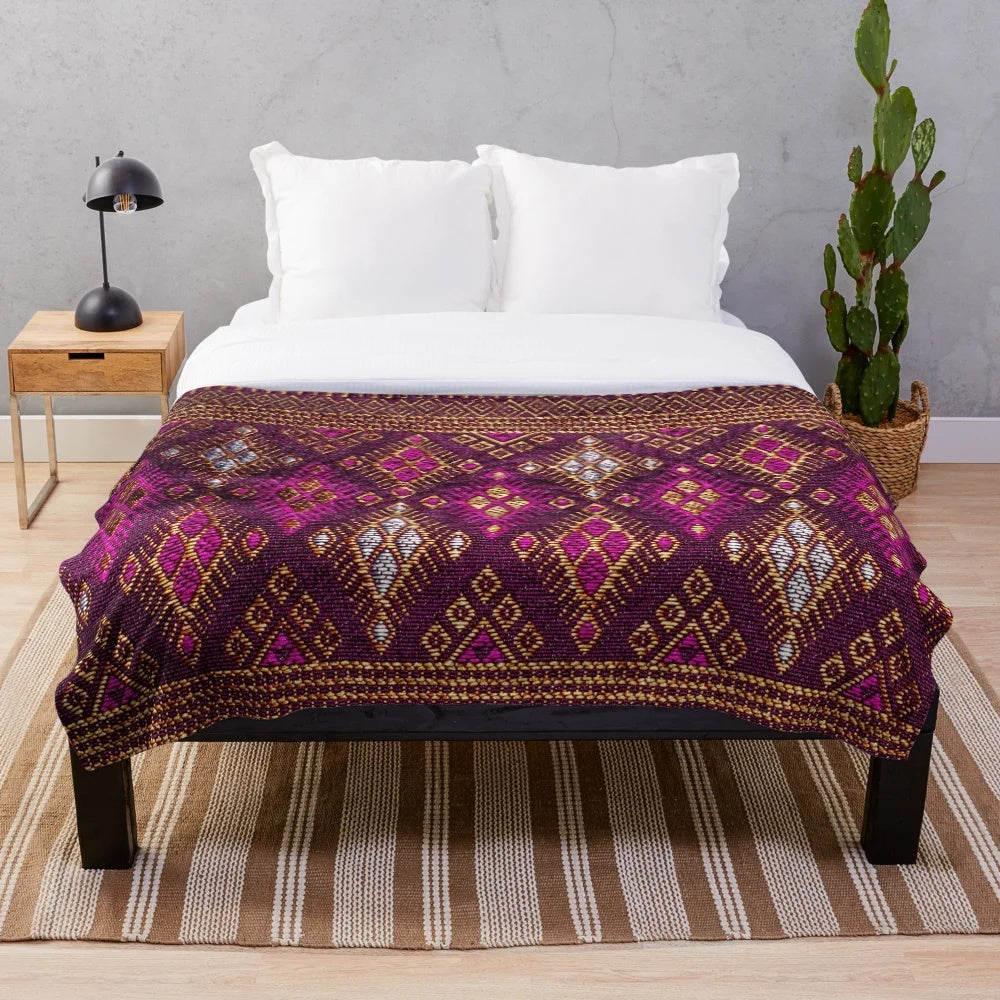 Thai silk plush blanket with pink gold tones and traditional silkworm design