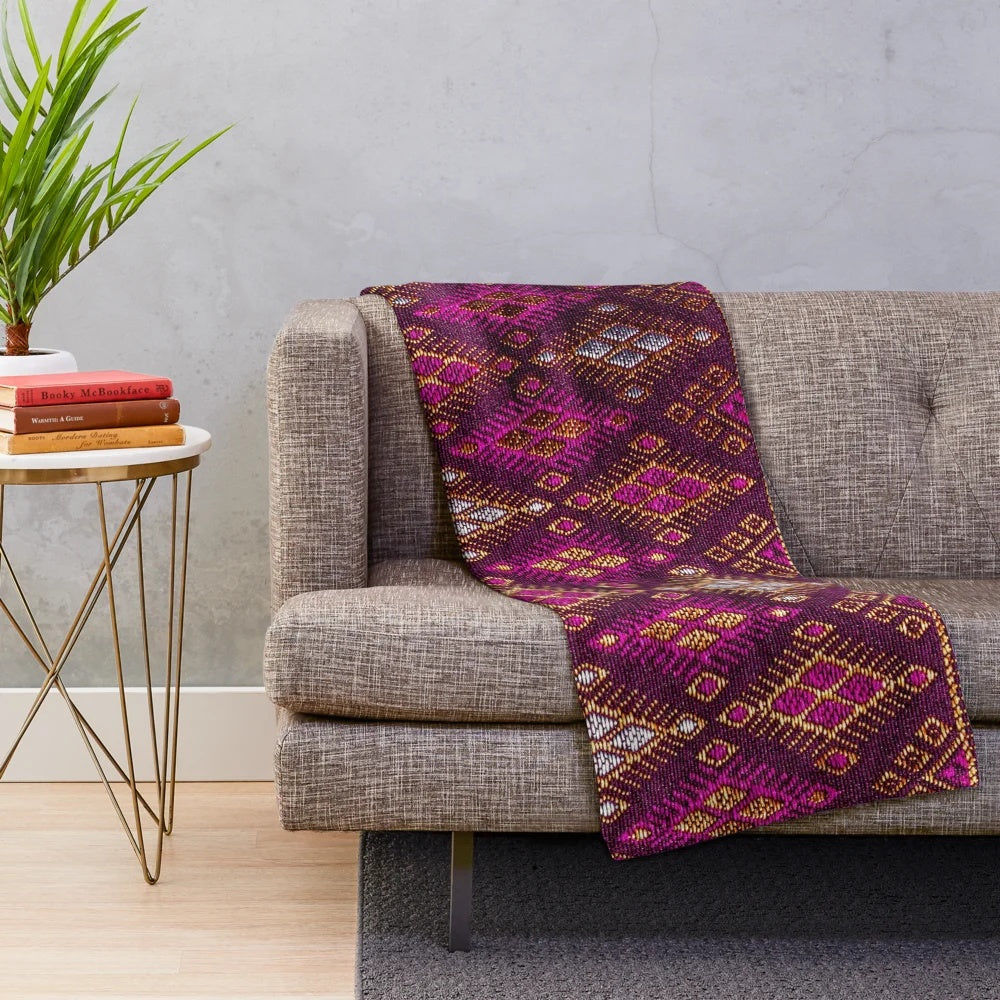 Thai silk plush blanket with pink gold tones and traditional silkworm design