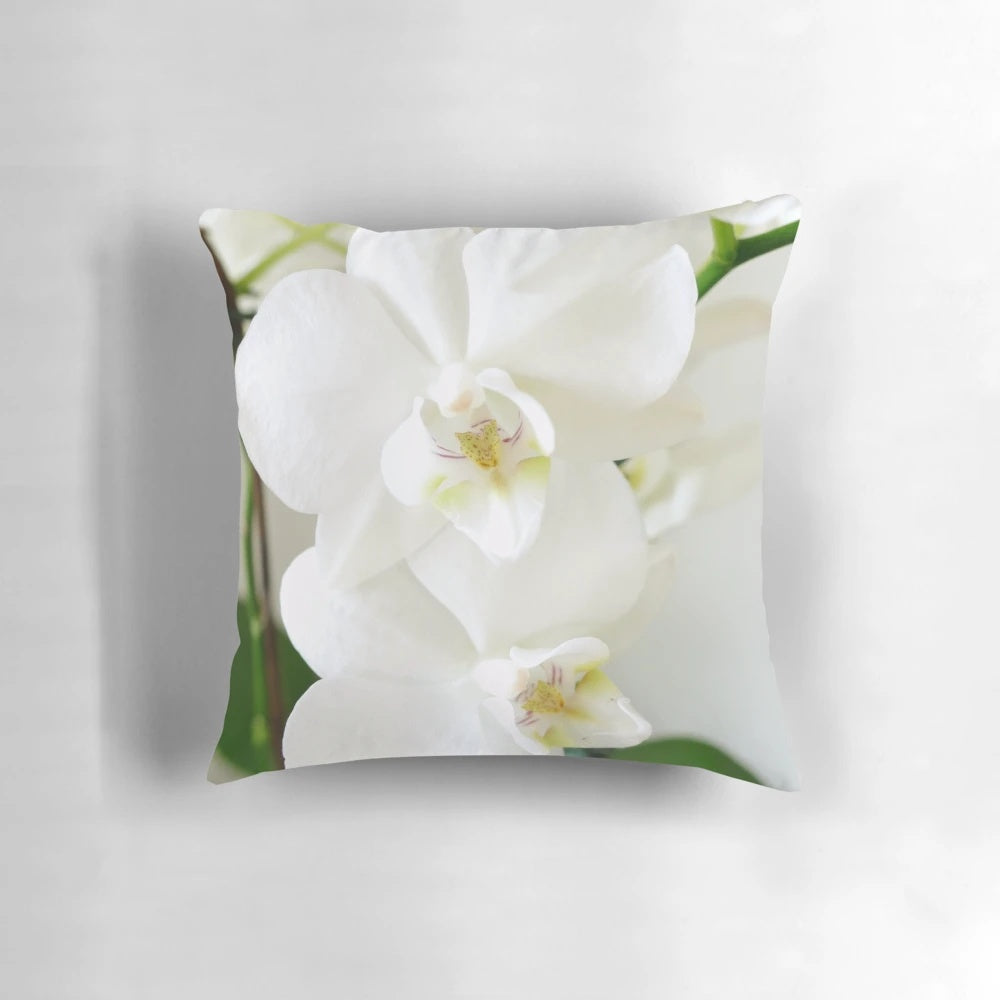 Gorgeous white orchid flowers printed on a soft, plush pillow for a touch of natural elegance in any room.