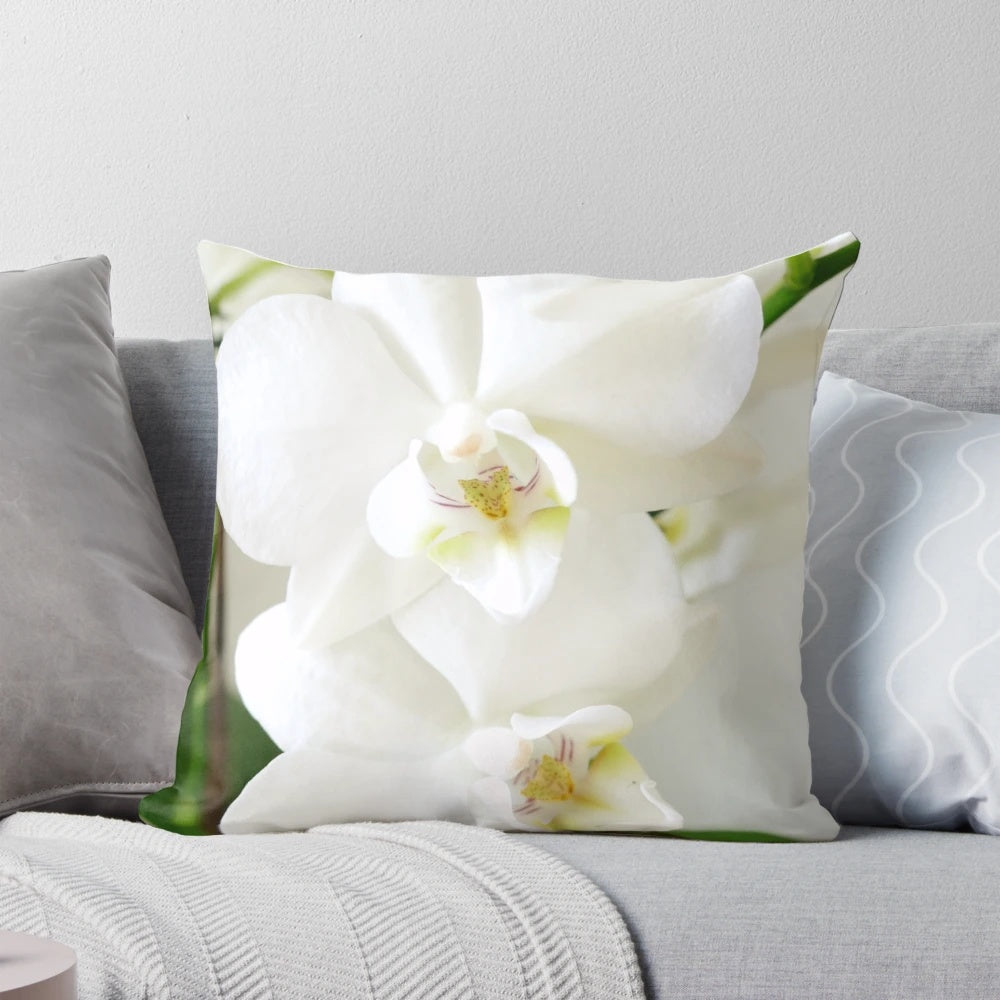 Gorgeous white orchid flowers printed on a soft, plush pillow for a touch of natural elegance in any room.