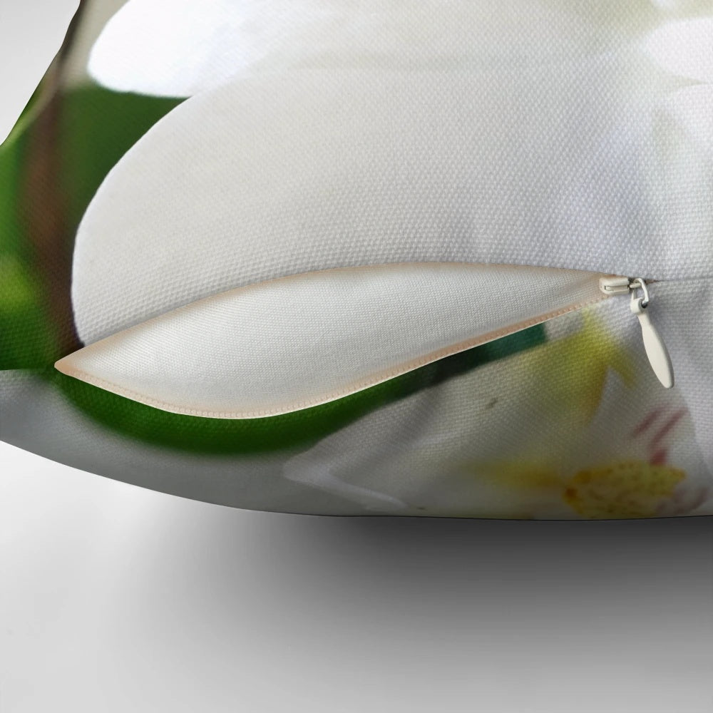 Gorgeous white orchid flowers printed on a soft, plush pillow for a touch of natural elegance in any room.