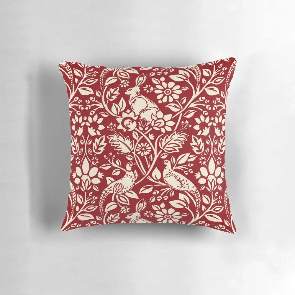 Luxurious deep red and cream pillow featuring a beautiful pheasant and hare pattern in the art nouveau style