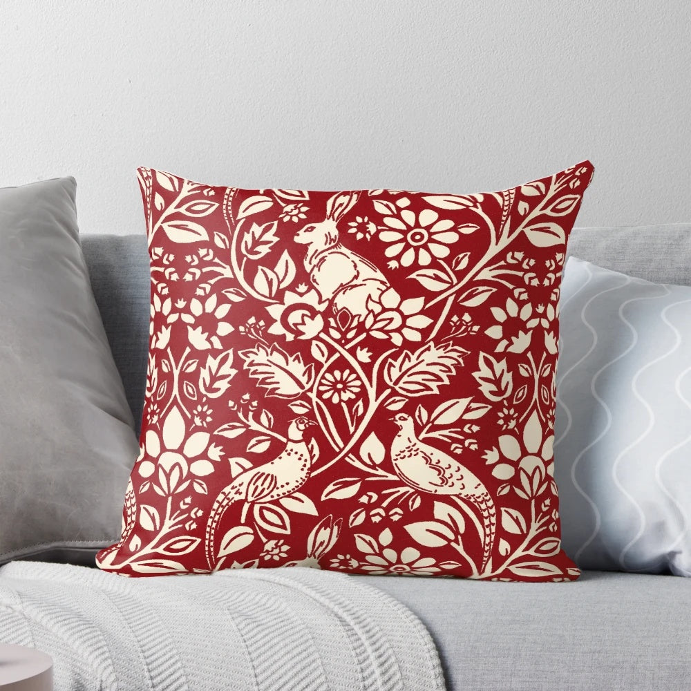 Luxurious deep red and cream pillow featuring a beautiful pheasant and hare pattern in the art nouveau style