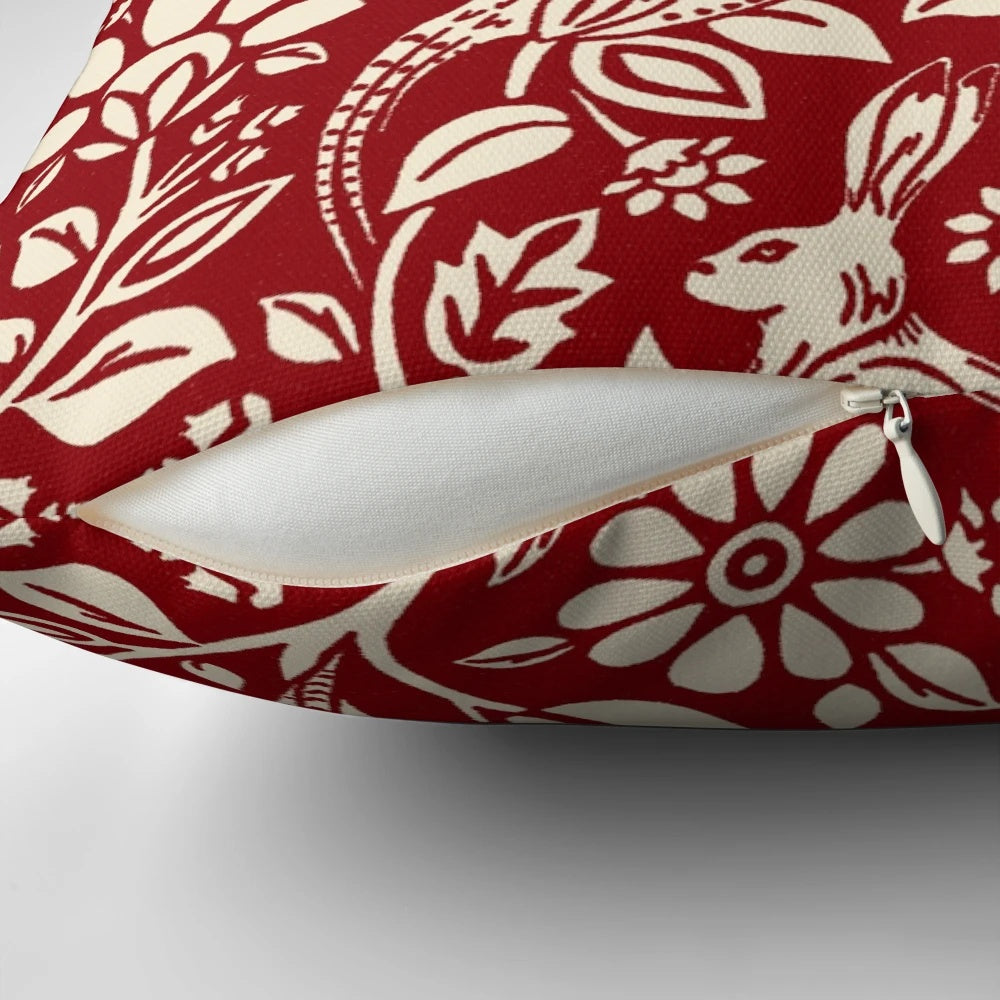 Luxurious deep red and cream pillow featuring a beautiful pheasant and hare pattern in the art nouveau style