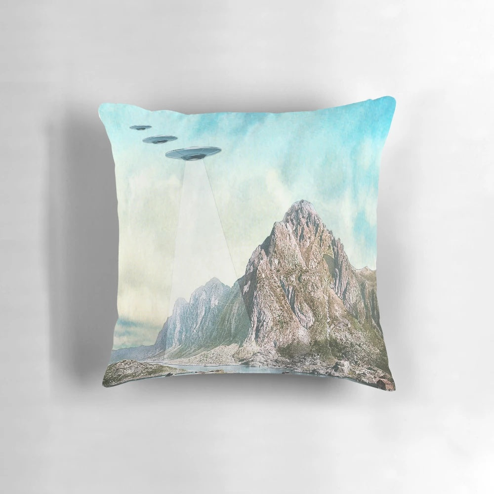 Pillow featuring a collage of UFOs, aliens, and other cryptid imagery inspired by the Eugenia Loli art style