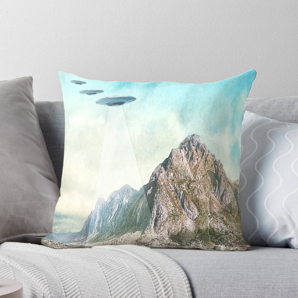 Pillow featuring a collage of UFOs, aliens, and other cryptid imagery inspired by the Eugenia Loli art style