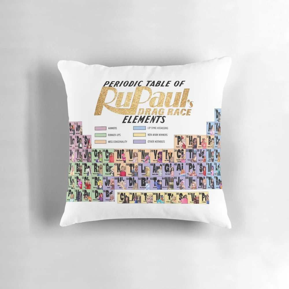 A decorative throw pillow featuring a periodic table design with the names of famous drag queens from RuPaul's Drag Race.