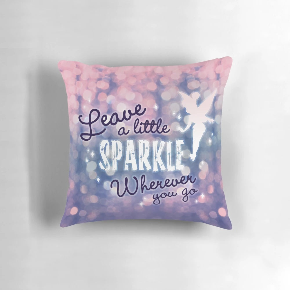 A white pillow with a fairy and glitter design and inspirational typography.