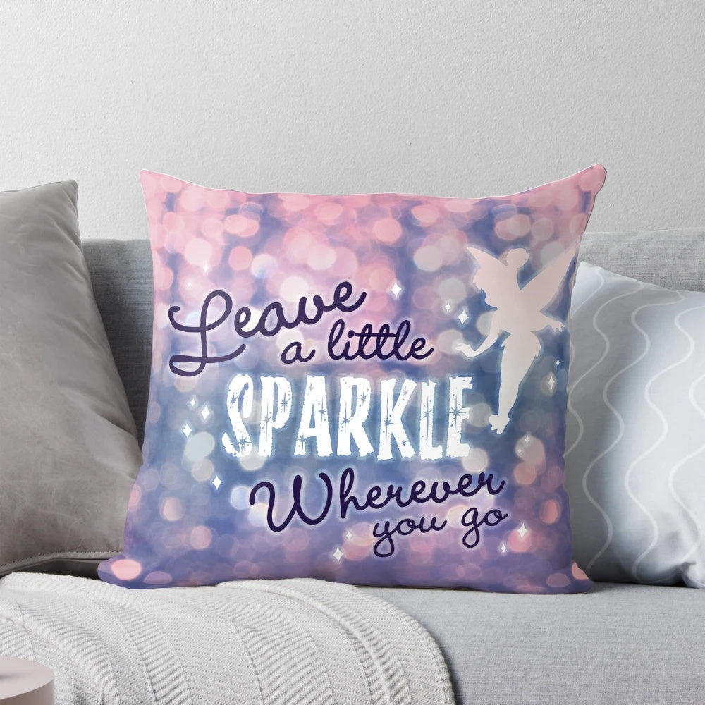 A white pillow with a fairy and glitter design and inspirational typography.