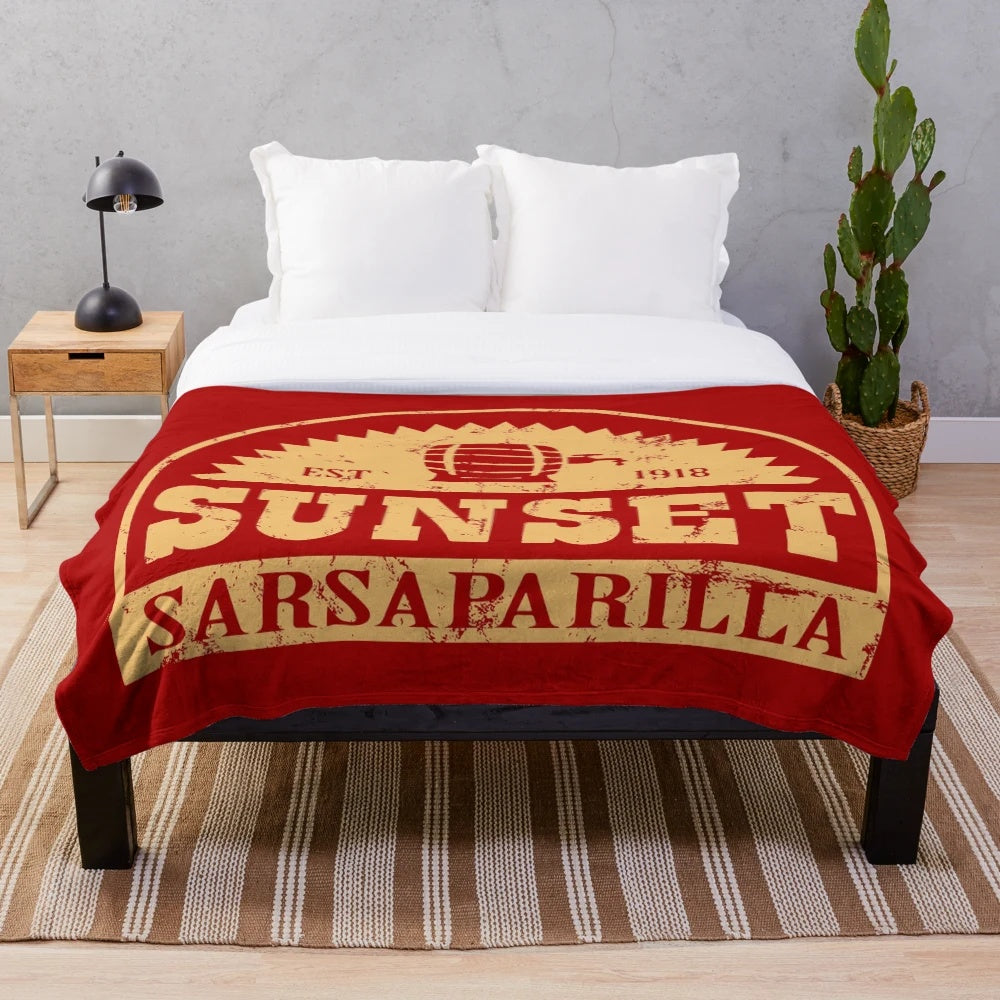 Fallout-inspired plush blanket featuring the Sunset Sarsaparilla logo