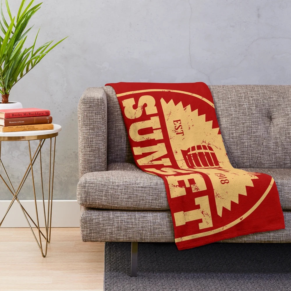 Fallout-inspired plush blanket featuring the Sunset Sarsaparilla logo