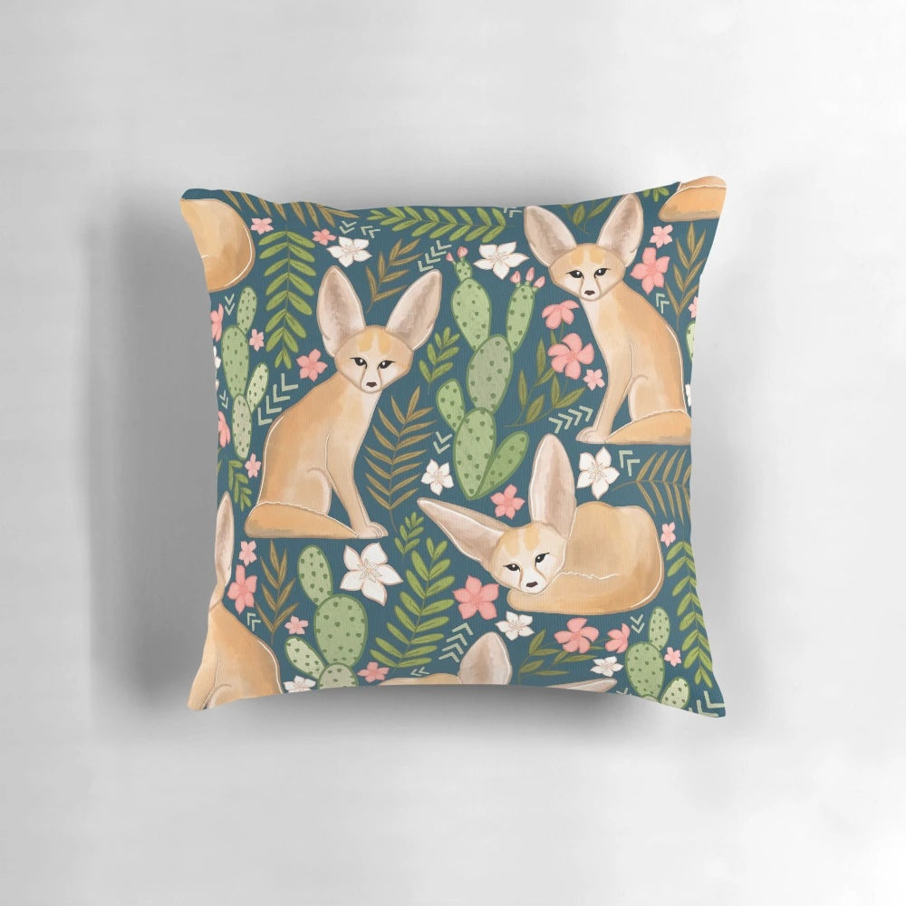 Soft, navy blue pillow featuring a print of enchanting fennec foxes, the small desert-dwelling canines native to the Sahara.