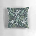 A decorative throw pillow featuring a whimsical forest dragon design in shades of green on a dark green background, perfect for nature-inspired home decor.