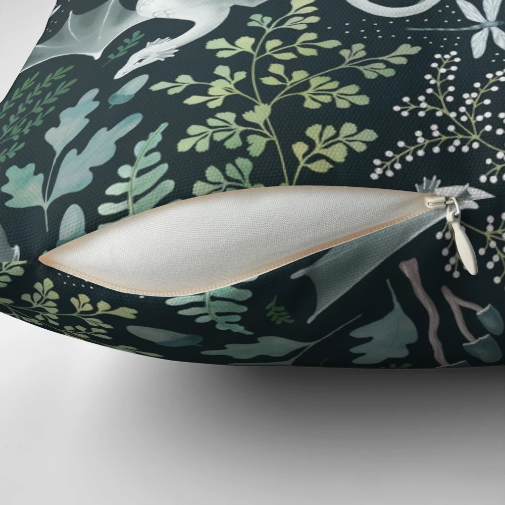 A decorative throw pillow featuring a whimsical forest dragon design in shades of green on a dark green background, perfect for nature-inspired home decor.