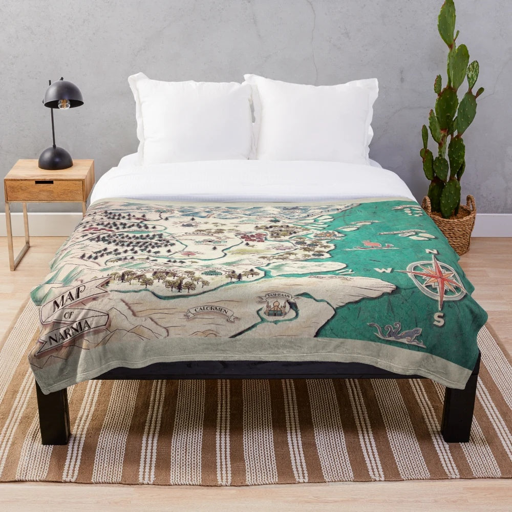 Narnia-inspired plush blanket with a map of the fantasy world
