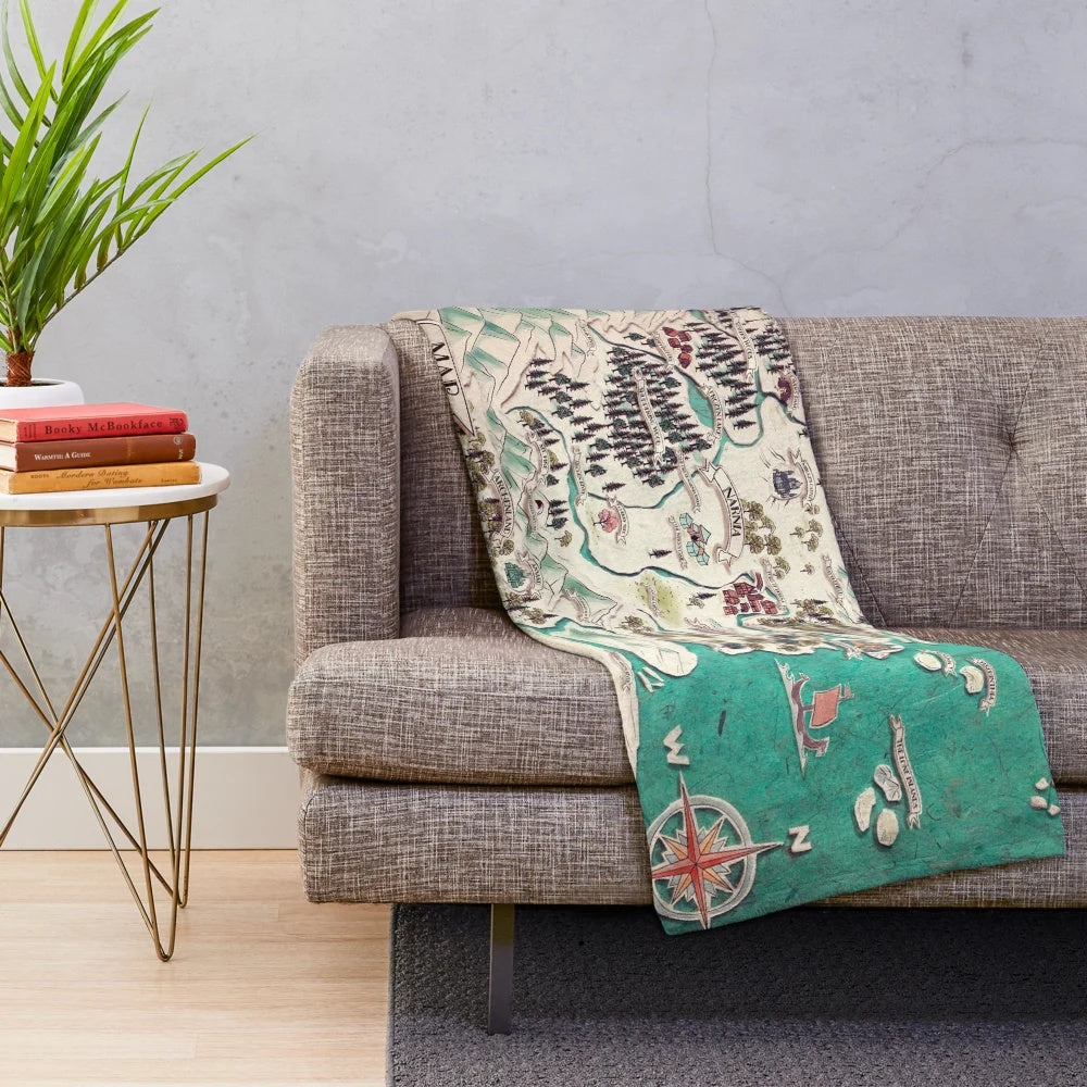 Narnia-inspired plush blanket with a map of the fantasy world