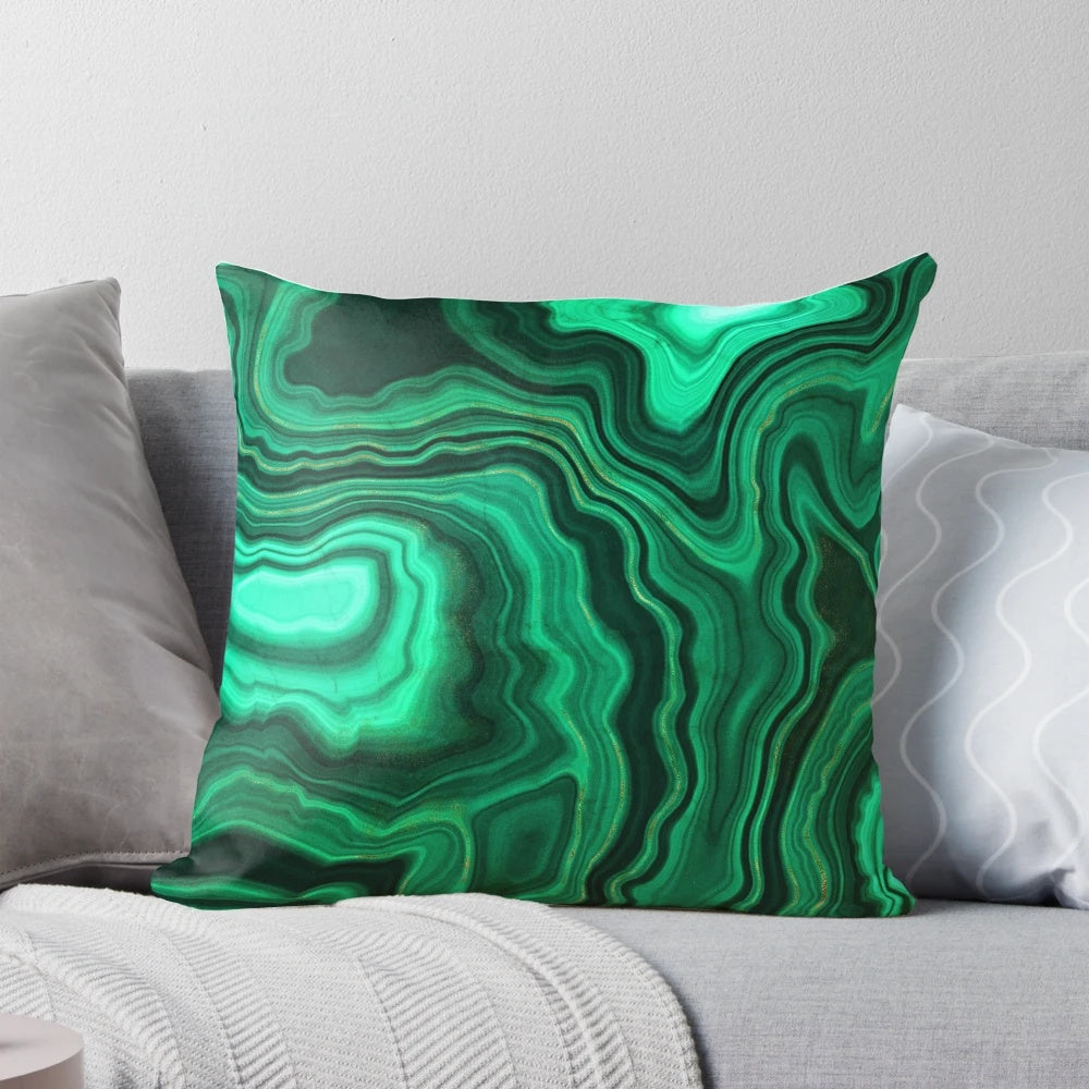 Luxurious green and gold faux malachite marble pillow with a natural, geological textured design