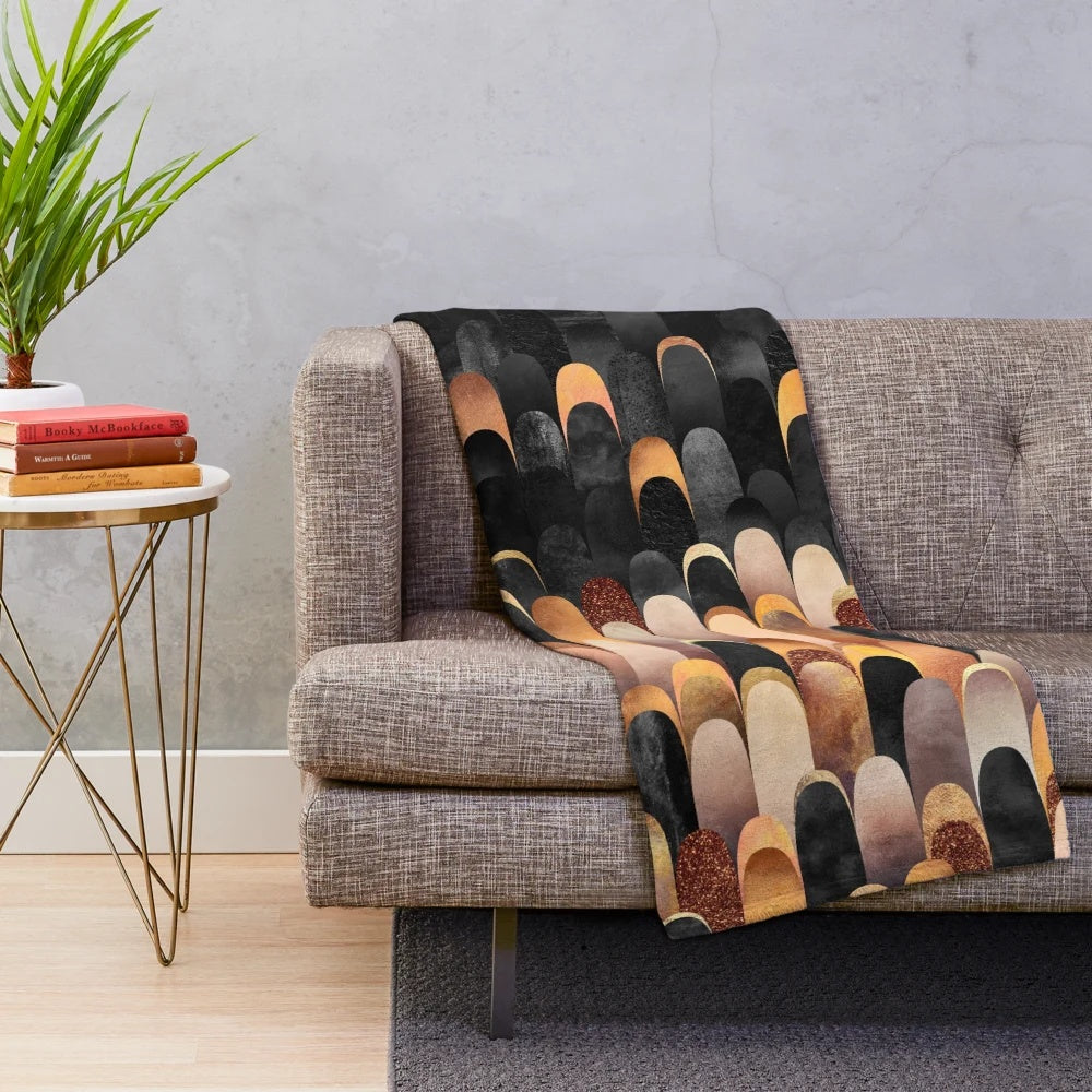 Copper and black plush blanket with abstract feathered pattern