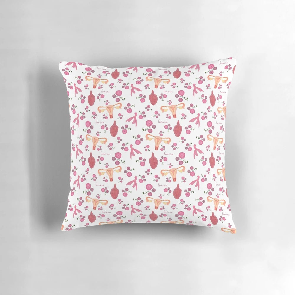 Pillow with illustrations of female anatomy, including the vulva and uterus, representing feminism and women's empowerment.