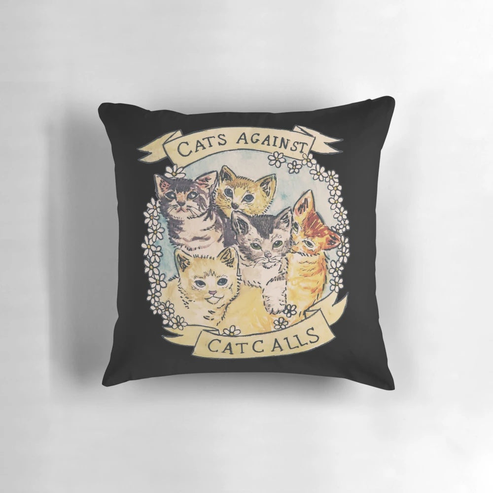 A decorative throw pillow featuring a design of cats with flowers, representing a feminist and anti-catcalling message.