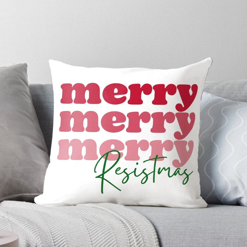 Feminist Christmas quote pillow with "Merry Resistmas" text and modern minimalist graphic design