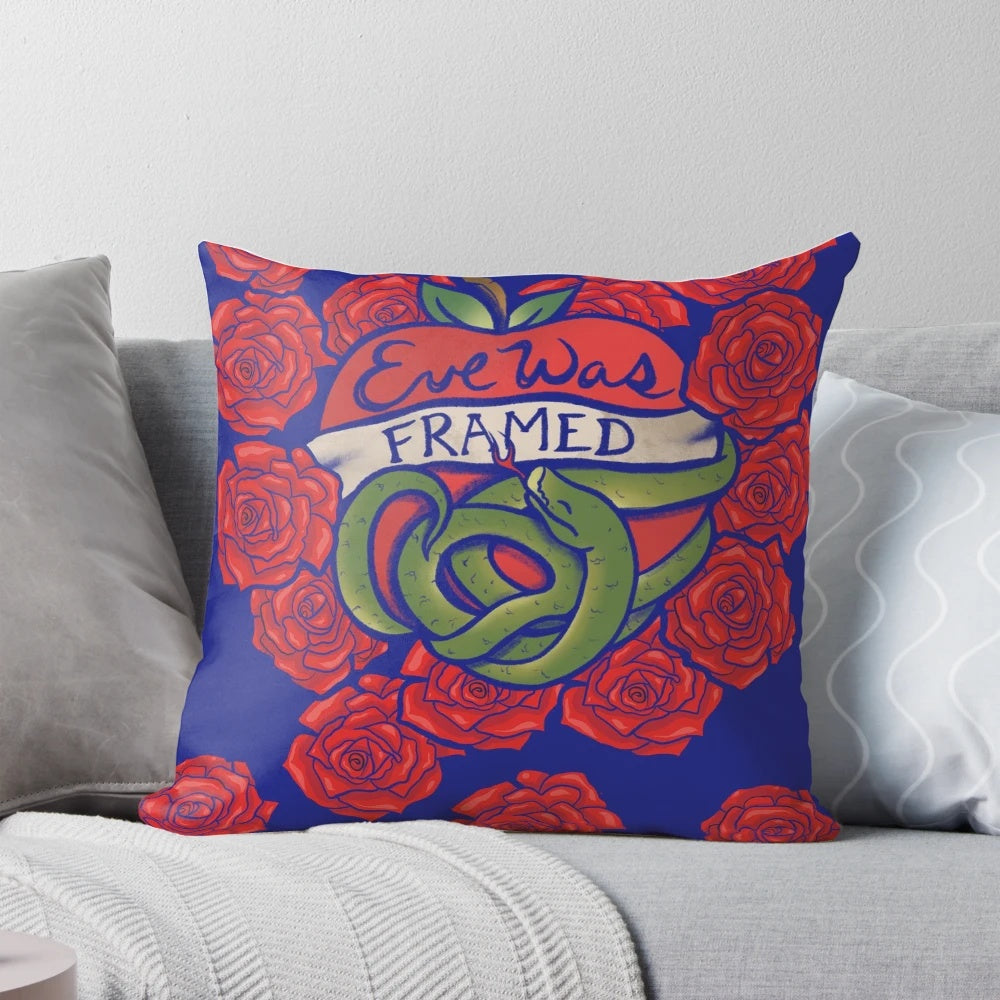 Decorative throw pillow with "Eve Was Framed" text and biblical Garden of Eden design, featuring feminist and Christian themes.