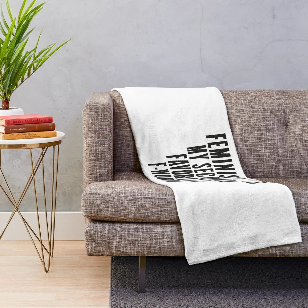 Plush blanket with "Feminist is My Second Favorite F Word" text