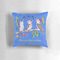 Colorful Christmas pillow featuring a singing kookaburra, a native Australian bird, against a background of holiday carols.