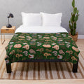 Cozy and soft plush blanket featuring a ball python in a holiday design