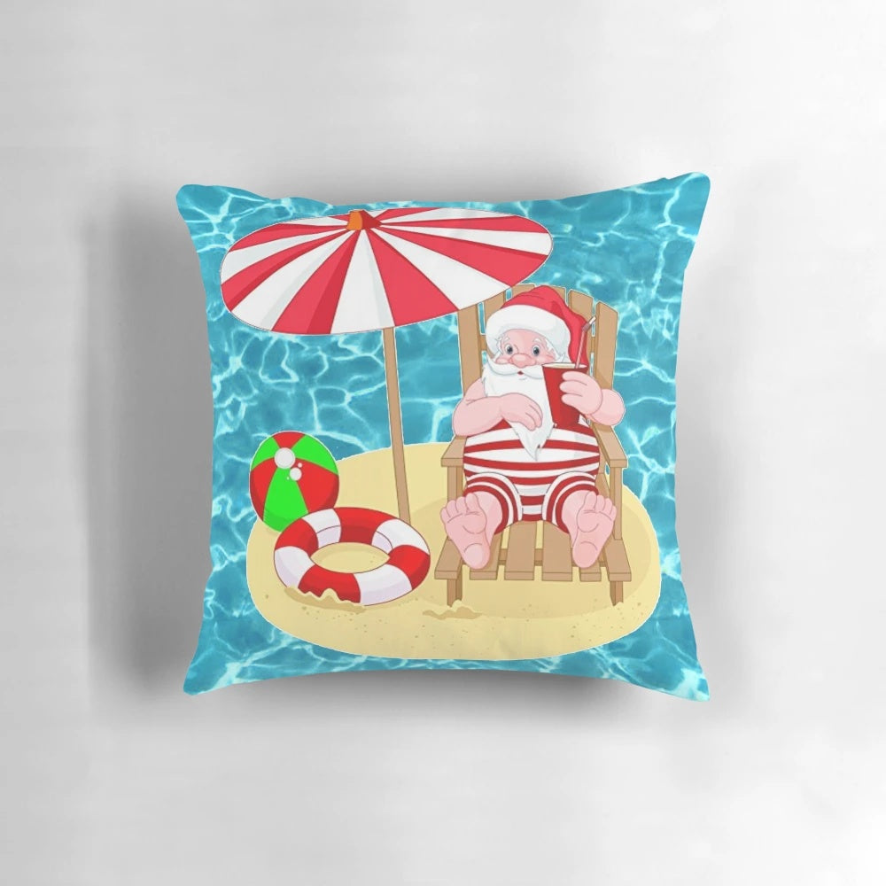 A colorful Pillow featuring a Santa Claus relaxing on a beach with palm trees and a beach ball.