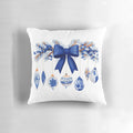 Blue and white chinoiserie-style Christmas pillow with pine branches, berries, and a bow