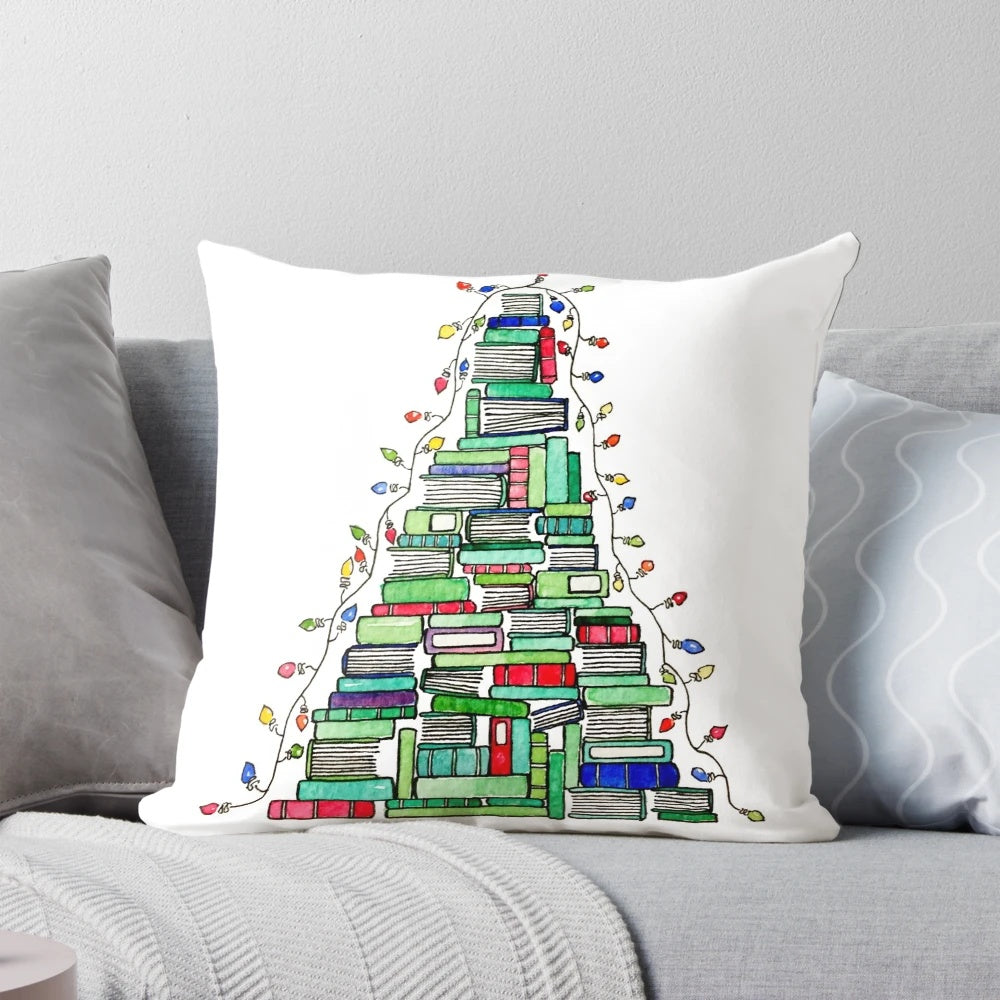 A decorative pillow featuring a stack of books arranged in the shape of a Christmas tree, perfect for book lovers during the winter holidays.