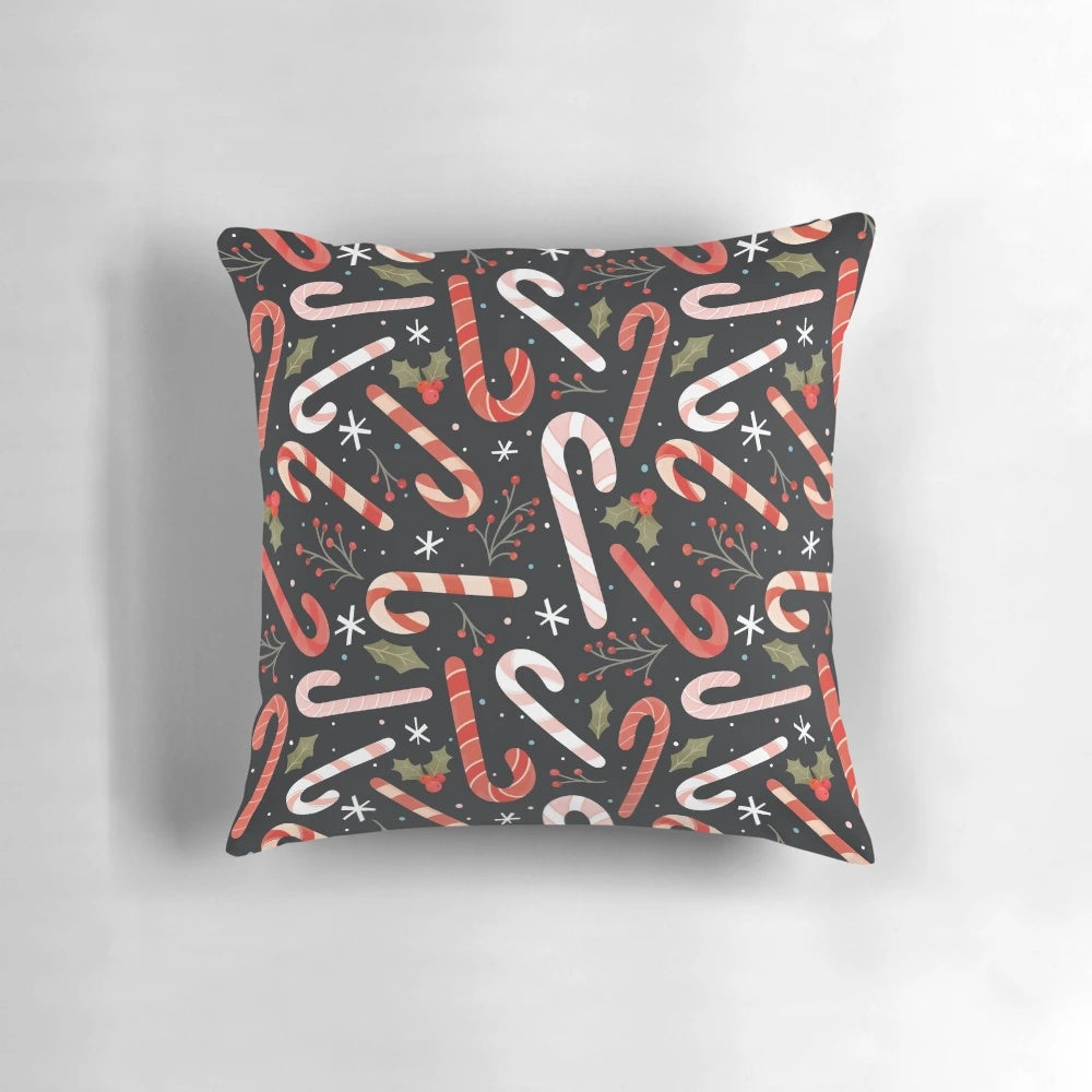 Vibrant candy cane-patterned Christmas pillow with holly and snowflake accents