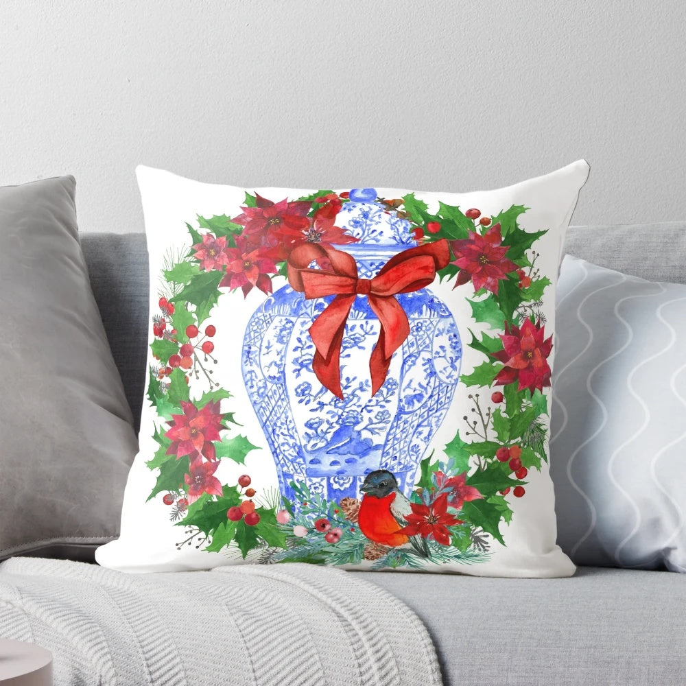 Chinoiserie-style Christmas wreath featuring a blue and white porcelain ginger jar and poinsettias