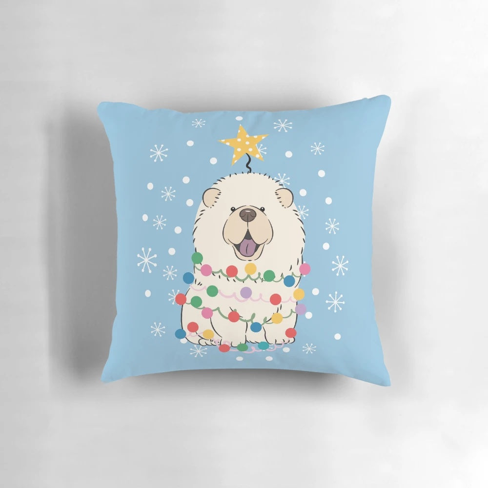 Fluffy white chow chow dog sitting on a Christmas tree-shaped pillow