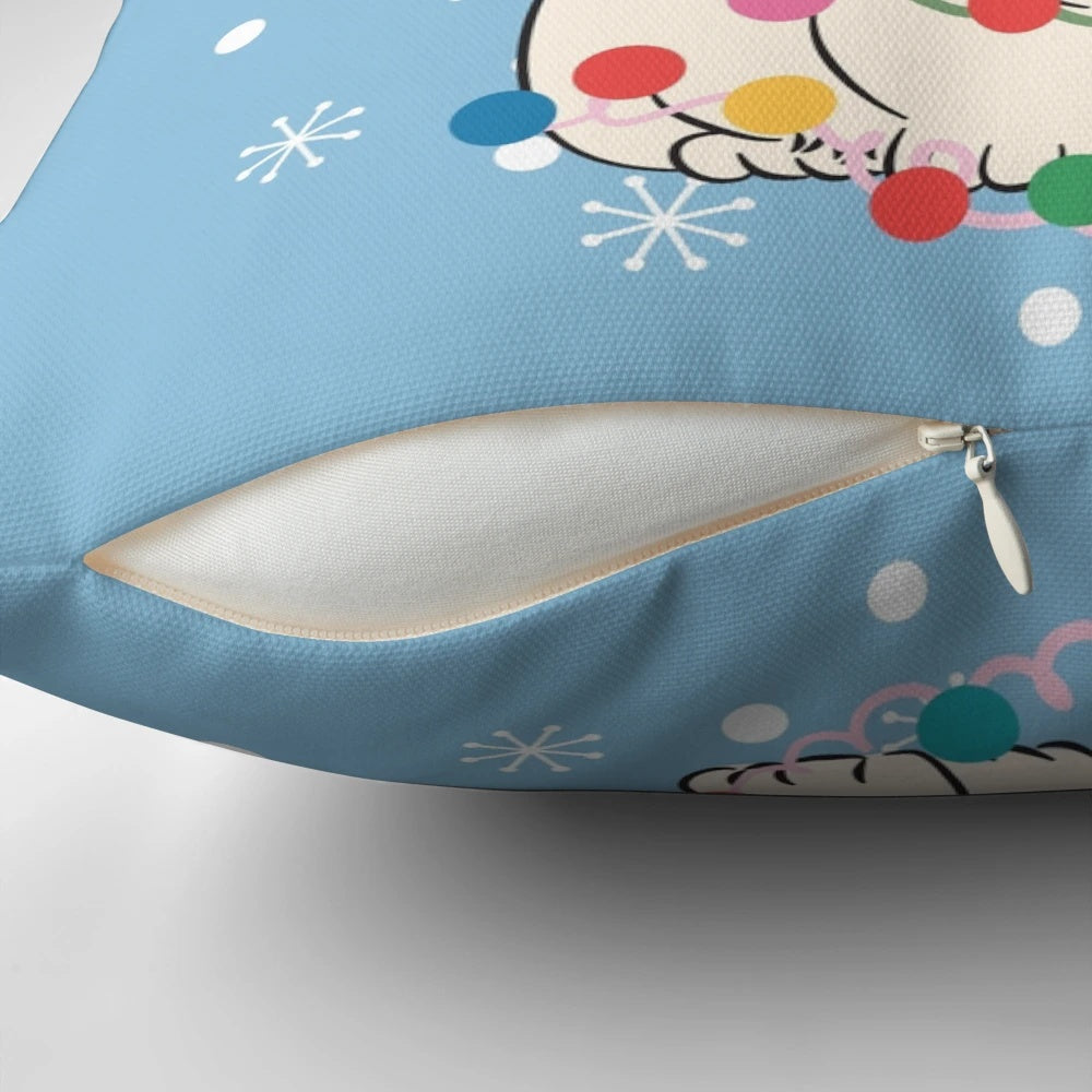 Fluffy white chow chow dog sitting on a Christmas tree-shaped pillow