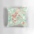 A cozy Christmas baking-themed pillow with holiday designs like cookies, candy canes, and snowflakes.
