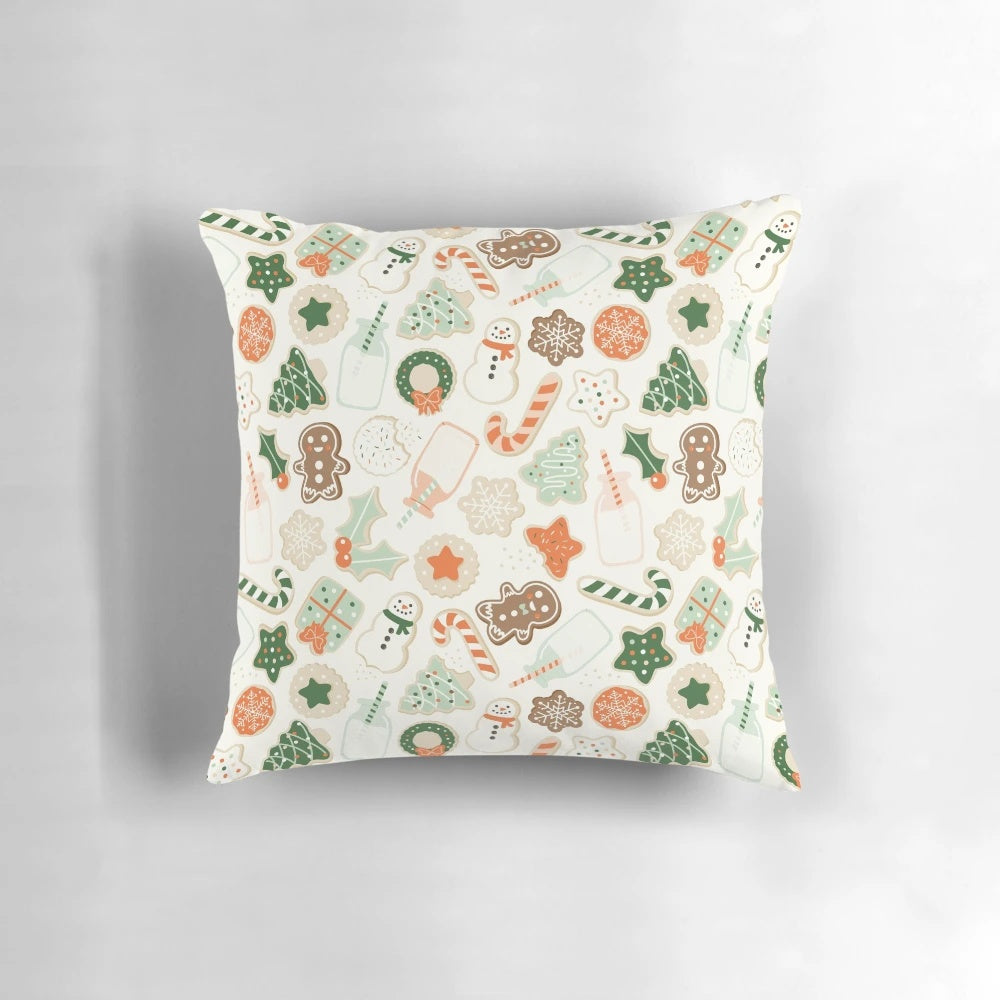 A festive Christmas cookies throw pillow featuring a colorful vector pattern of gingerbread, sprinkles, and holiday elements.