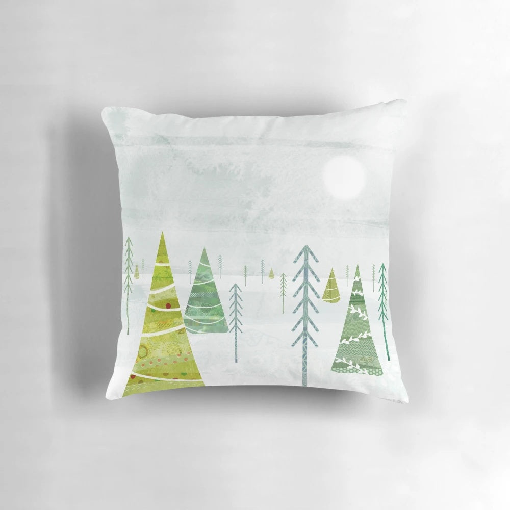 Soft, plush Christmas forest-themed throw pillow with pine trees, snow, and winter imagery