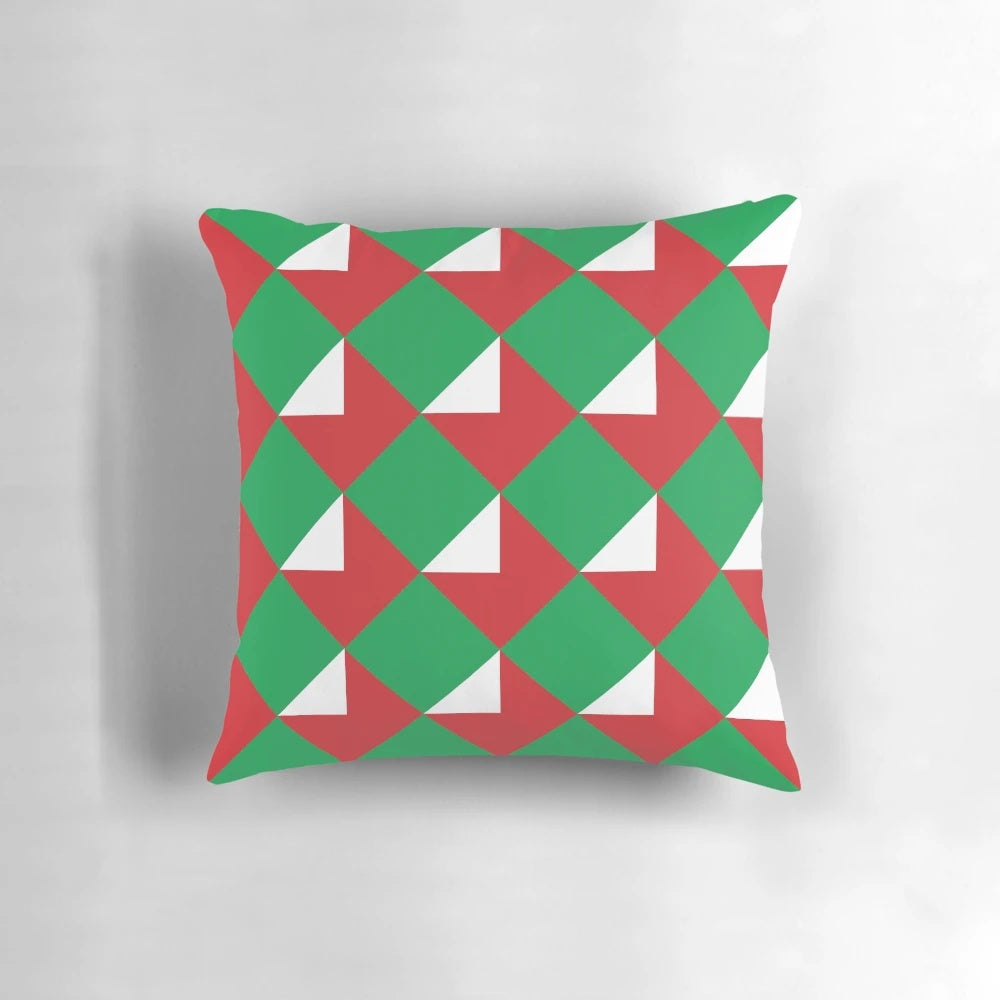 Colorful throw pillow with red, green, and white Christmas letters design