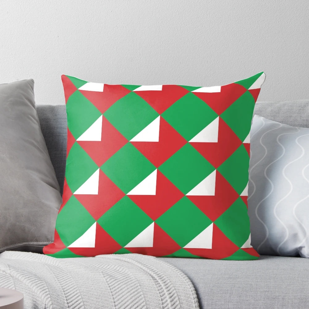 Colorful throw pillow with red, green, and white Christmas letters design