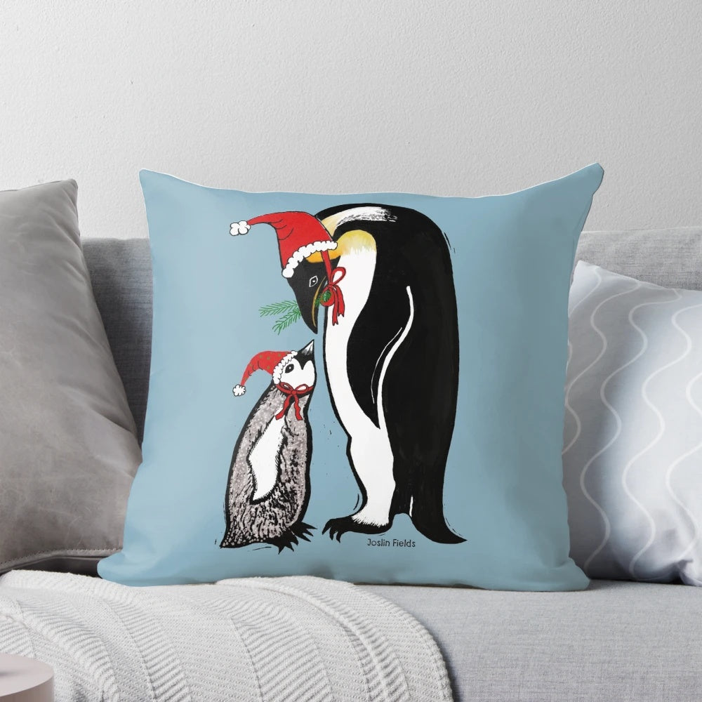 A colorful linocut-style pillow featuring a group of penguins wearing Santa hats, creating a playful and festive Christmas scene.