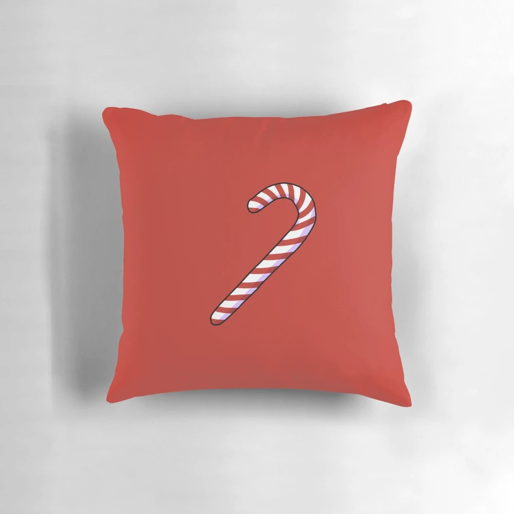 Decorative holiday pillow with a festive candycane design in red and white