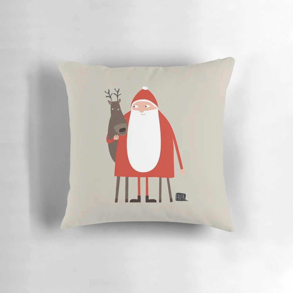 A plush Christmas pillow featuring a cartoon illustration of Santa Claus and his reindeer.
