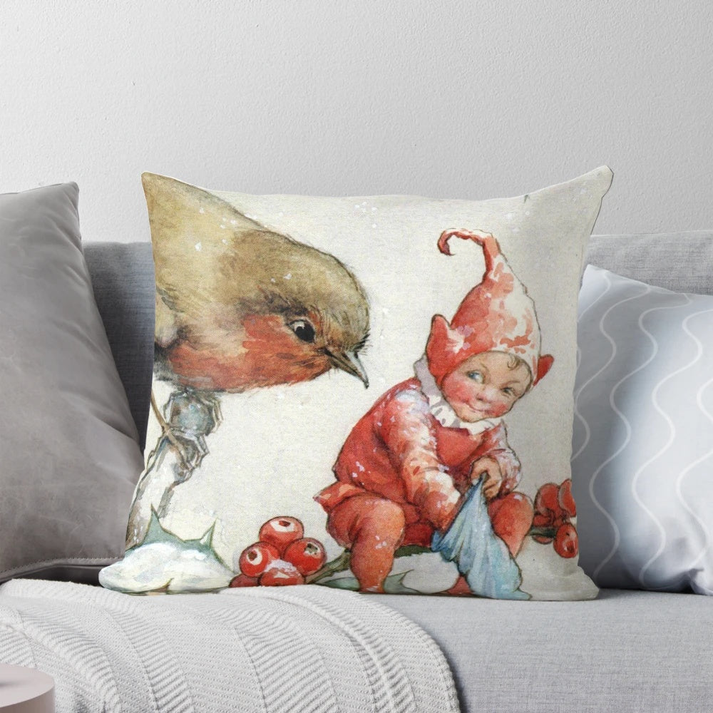 Decorative holiday pillow featuring a charming illustration of a Christmas robin and elf in a snowy woodland scene by artist Margaret Tarrant.