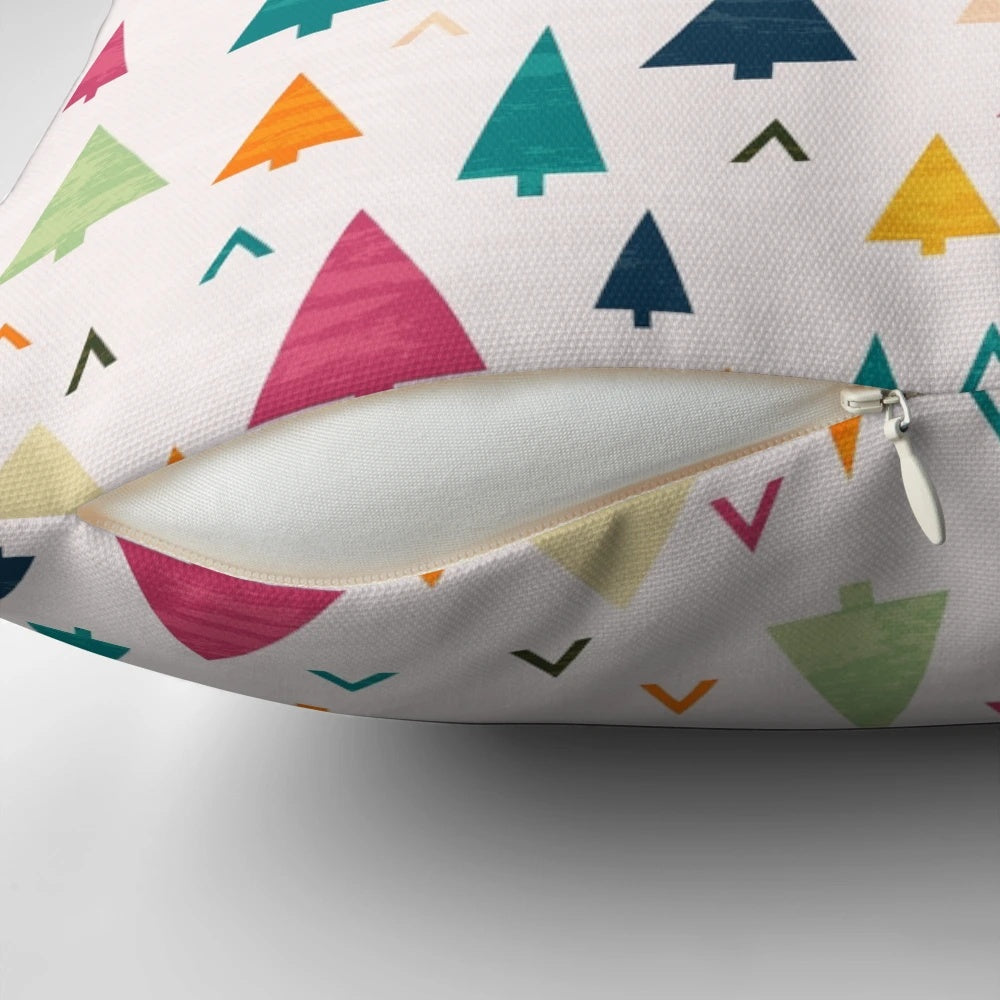 Vibrant, abstract Christmas tree design printed on a soft, plush pillow